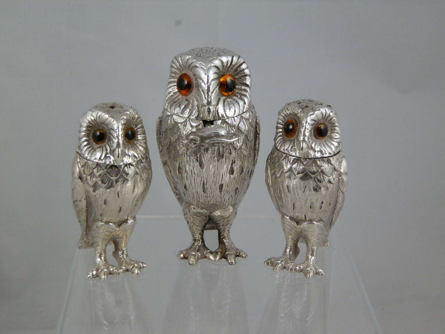 A William Comyns three piece owl condiment set. 1968