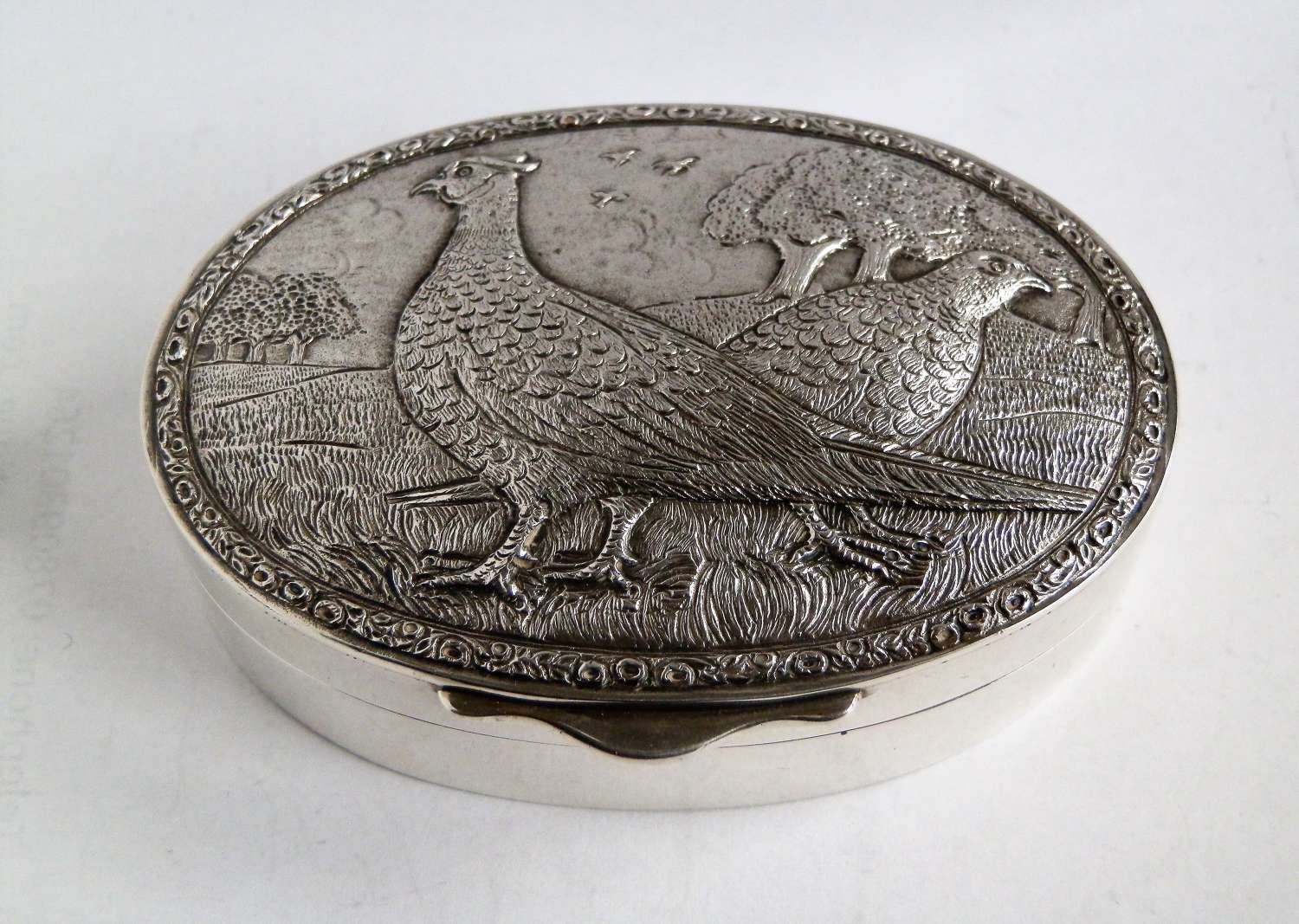 Elizabeth II silver snuff box with cast pheasants, 1983