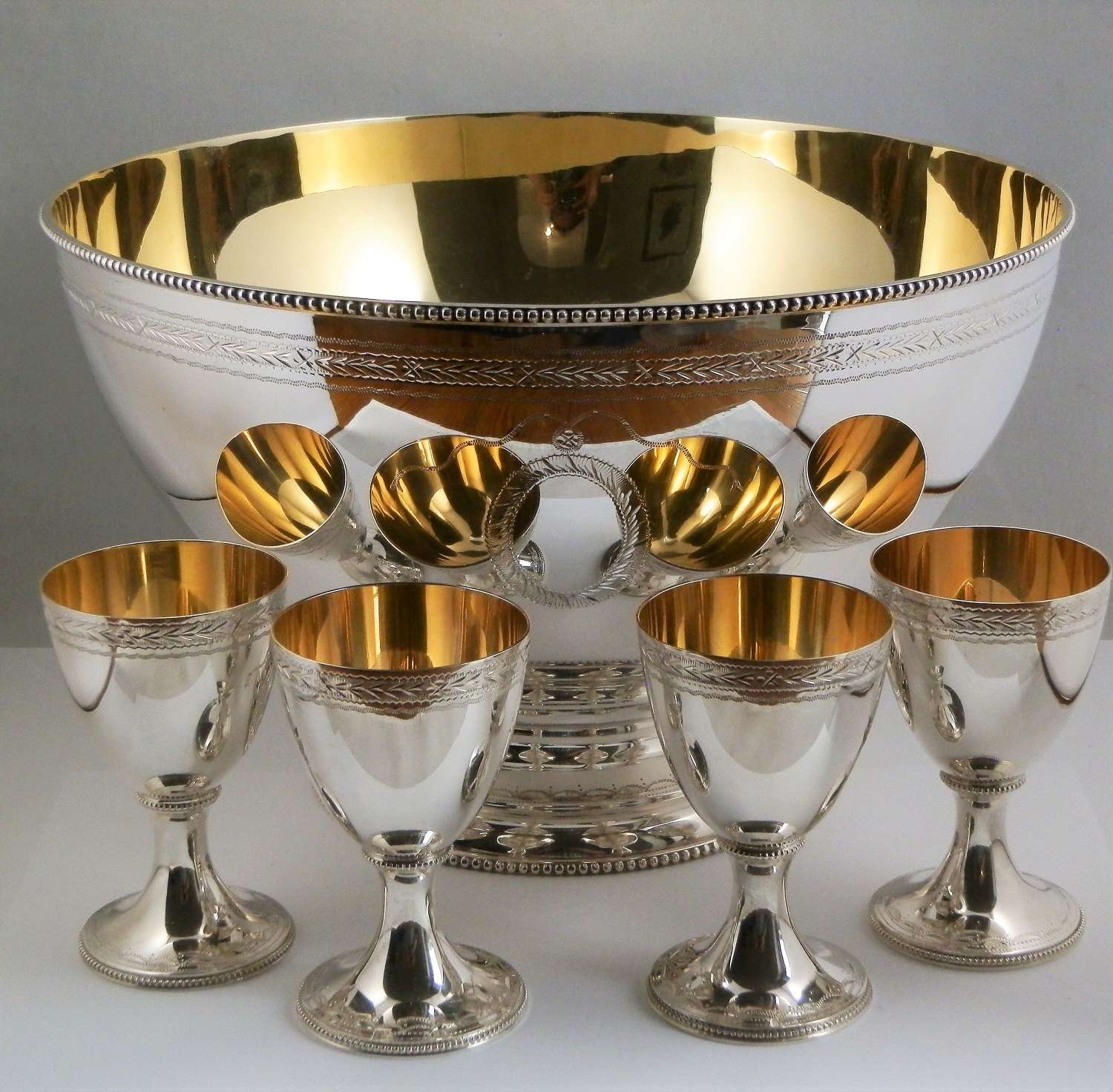 Elizabeth II silver punch bowl, ladle and 12 goblets, C.J.Vander 1973