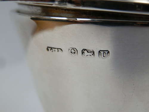 An Art Deco silver 2 piece tea strainer, Birmingham 1944