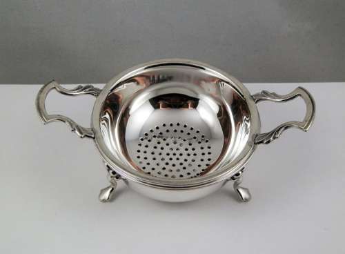 Elizabeth II silver two piece tea strainer, Birmingham 1962