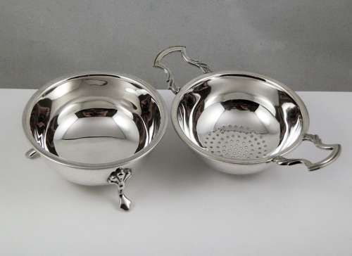 Elizabeth II silver two piece tea strainer, Birmingham 1962