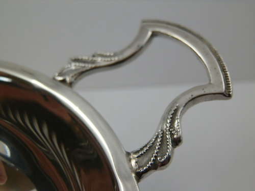 Elizabeth II silver two piece tea strainer, Birmingham 1962