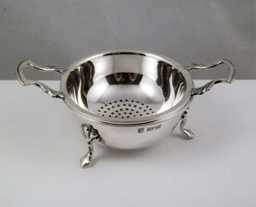 Elizabeth II silver two piece tea strainer, Birmingham 1962
