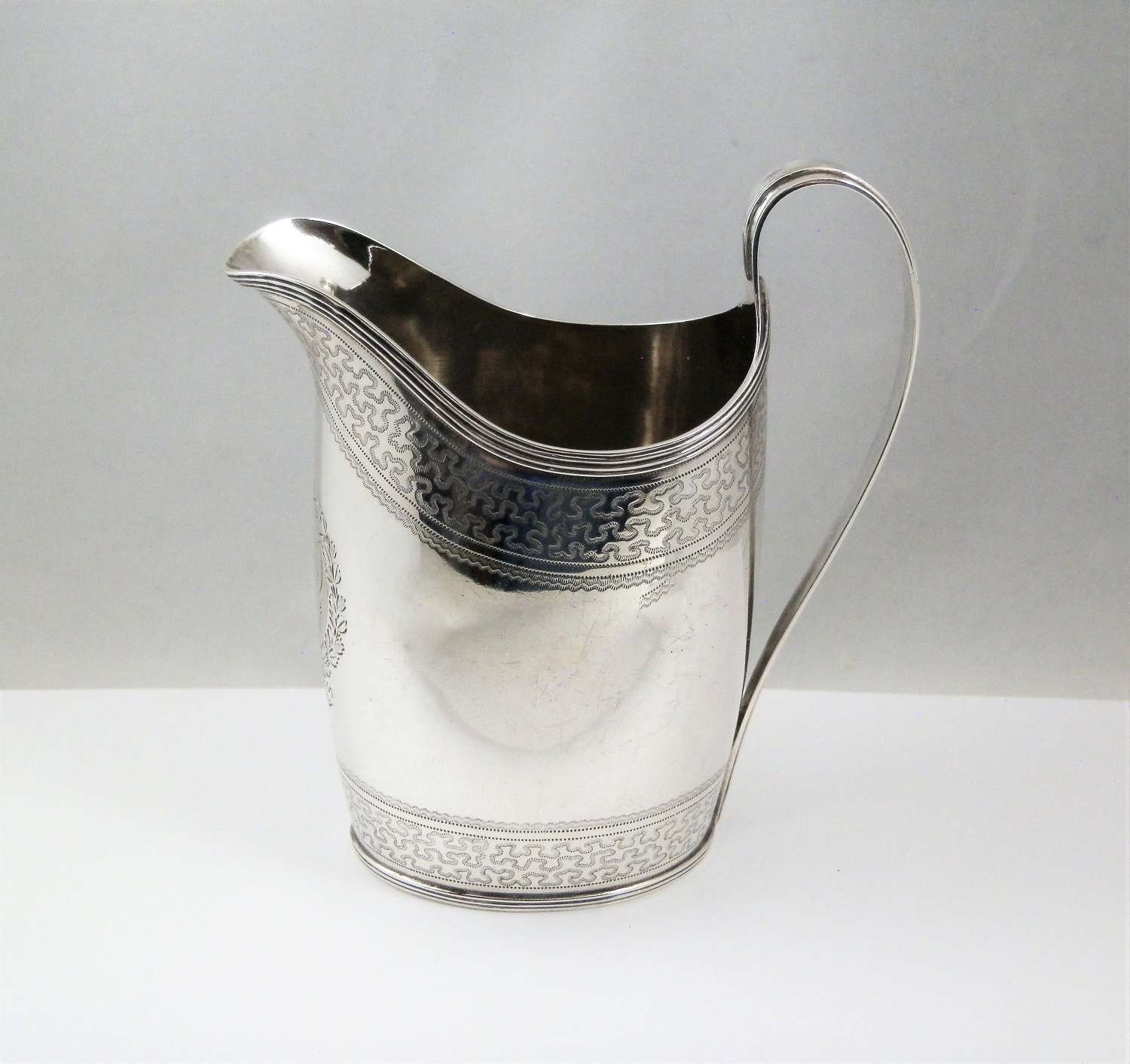 A George III silver Newcastle milk jug, Thomas Watson c.1794