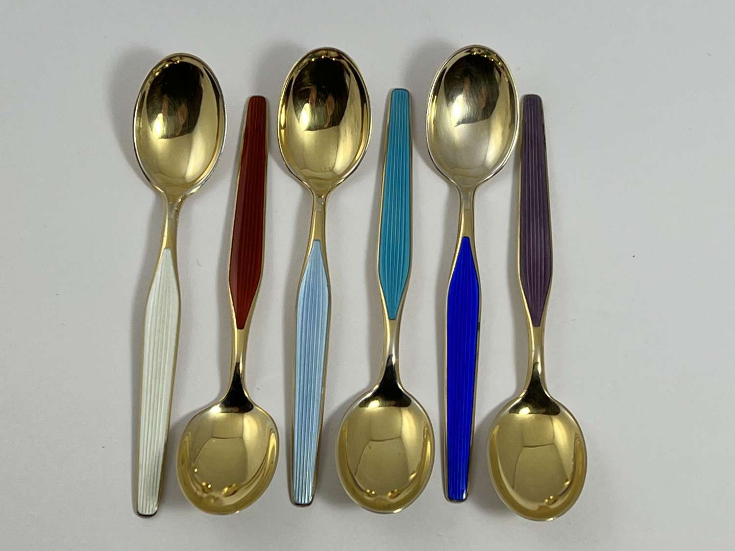 Norwegian silver gilt and enamel spoons,c 1970