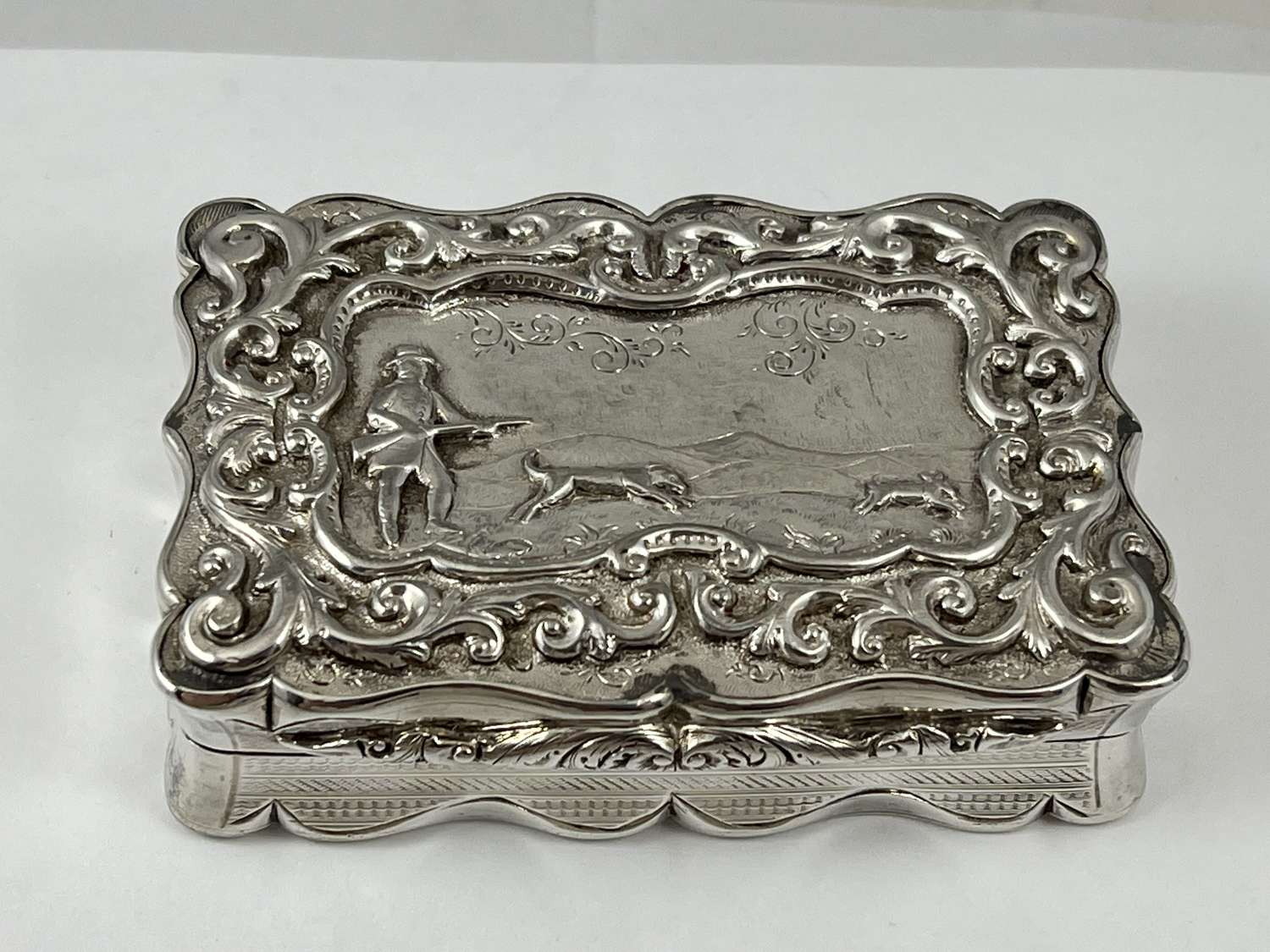 Victorian antique silver snuff box, cast shooting scene on top 1861