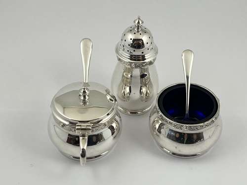 Cased 9 piece silver condiment set by Henderson & Sorley. Glasgow 1936