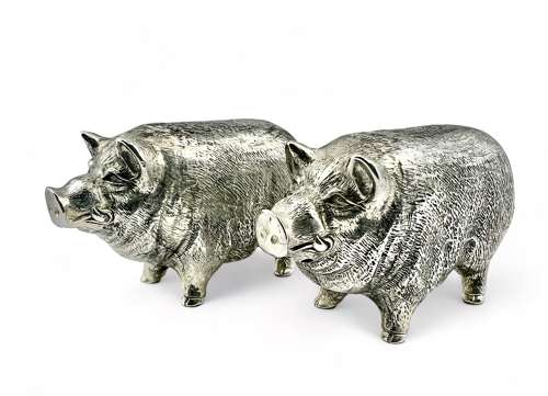 Pair of silver condiments styled as pigs, c 1960.